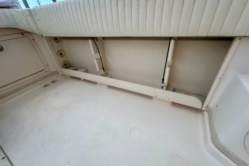 Slide: The Image of 2007 Grady-White Express 330 boat interior, featuring seating and storage compartments. - 48
