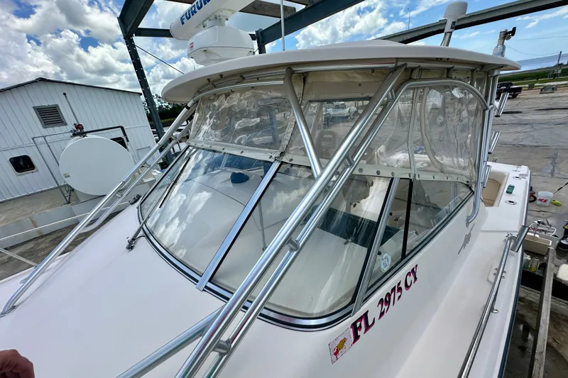 Slide: The Image of 2007 Grady-White Express 330 boat docked, featuring a sleek design and sturdy structure. - 32