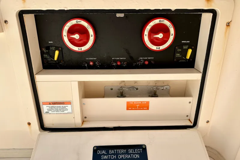 Slide: The Image of Control panel of a 2007 Grady-White Express 330 boat with dual battery switches. - 112