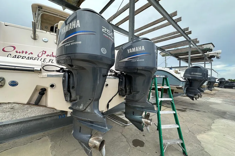 Slide: The Image of 2007 Grady-White Express 330 with Yamaha 250 outboard engines in a boatyard. - 9