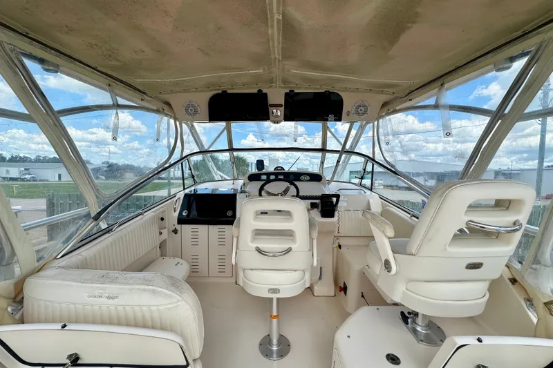 Slide: The Image of 2007 Grady-White Express 330 boat interior with helm, seating, and panoramic windows. - 57