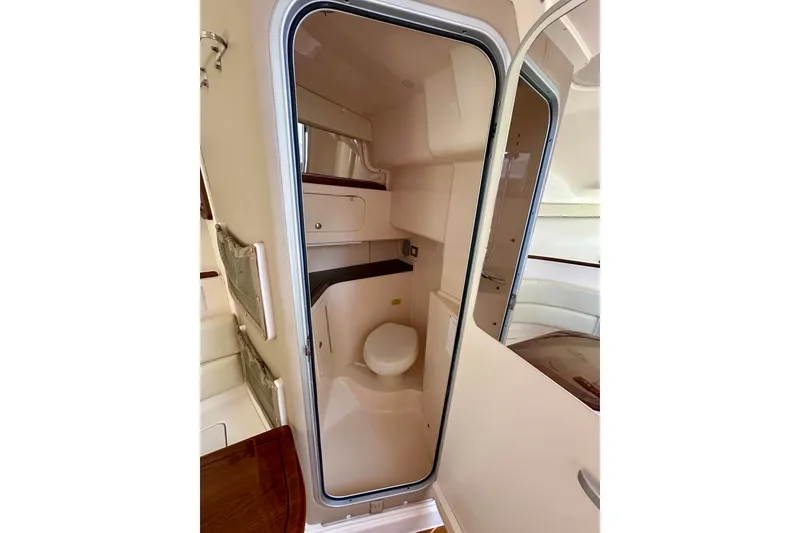 Slide: The Image of 2007 Grady-White Express 330 boat interior with compact bathroom and modern amenities. - 89