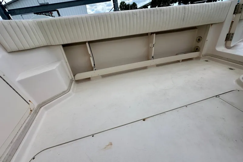 Slide: The Image of 2007 Grady-White Express 330 boat interior with white seating and spacious deck area. - 45