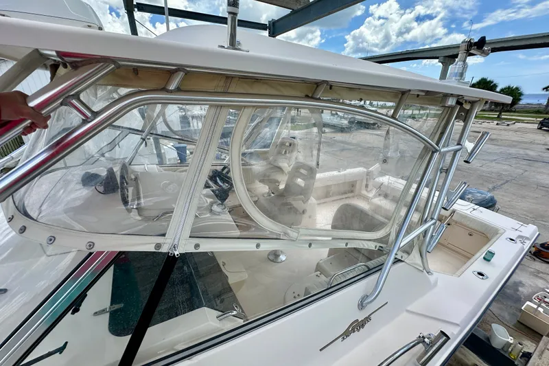 Slide: The Image of 2007 Grady-White Express 330 boat with clear enclosure and stainless steel frame. - 31