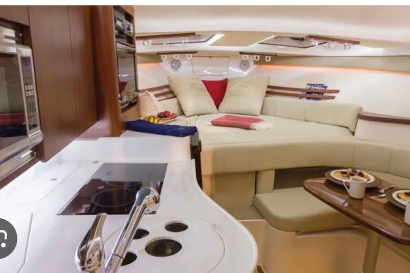 Slide: The Image of Luxurious interior of 2007 Grady-White Express 330 boat with cozy seating and modern kitchen. - 13