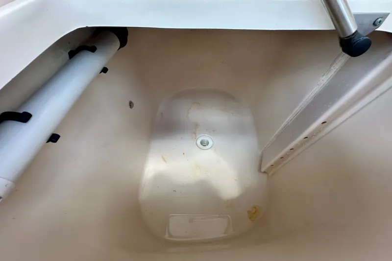 Slide: The Image of Interior compartment of 2007 Grady-White Express 330 boat, featuring a clean, white surface. - 55
