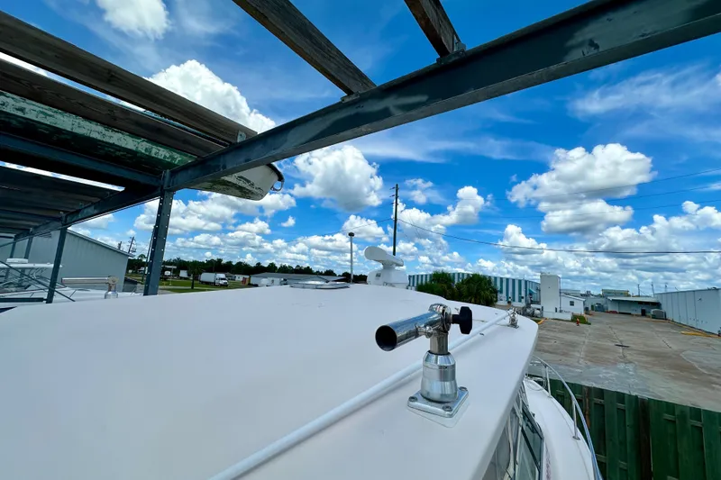 Slide: The Image of 2007 Grady-White Express 330 boat on dry dock under blue sky with clouds. - 40