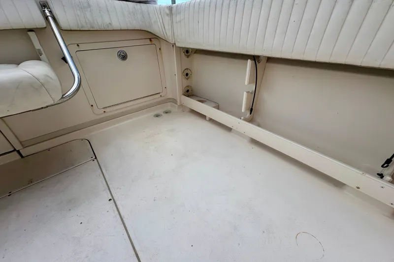 Slide: The Image of 2007 Grady-White Express 330 boat interior with seating and storage compartment. - 47