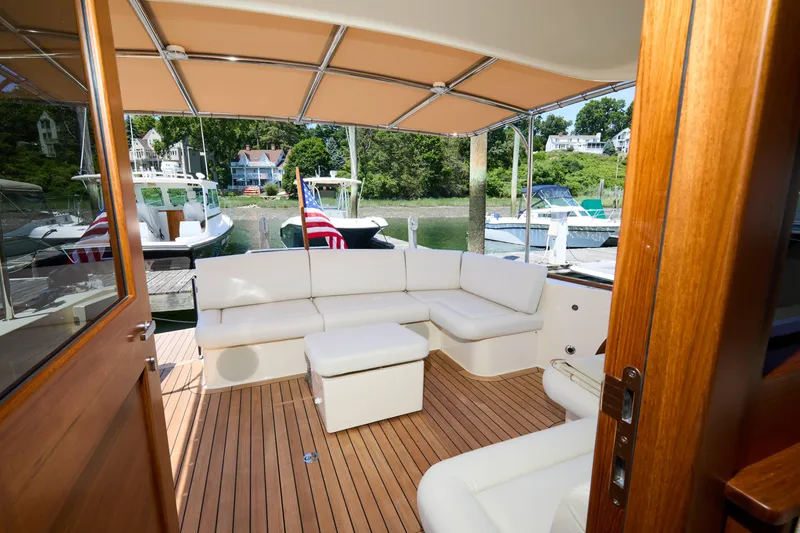 Slide: The Image of Luxurious interior of 2027 Palm Beach 42 yacht with elegant seating and wooden flooring. - 13