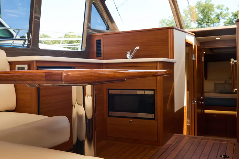 Slide: The Image of Luxurious interior of 2027 Palm Beach 42 yacht with elegant wood finishes and modern amenities. - 24