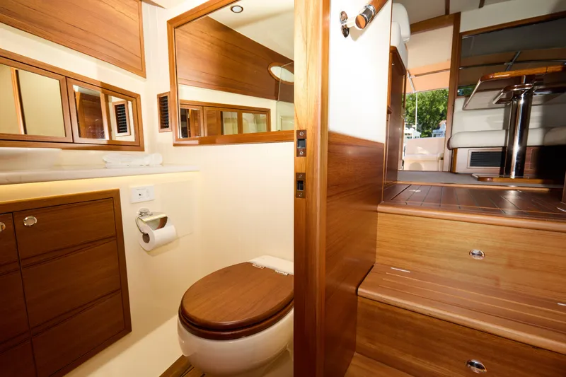 Slide: The Image of Luxurious bathroom interior of 2027 Palm Beach 42 yacht, featuring elegant wood finishes. - 42