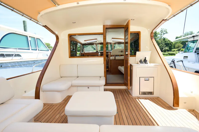 Slide: The Image of Luxurious interior of 2027 Palm Beach 42 yacht with elegant seating and wooden accents. - 8