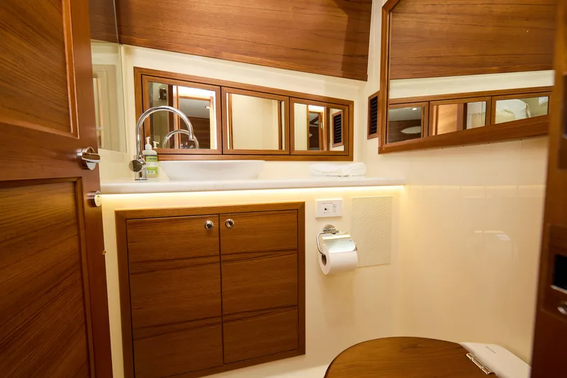 Slide: The Image of Luxurious bathroom interior of 2027 Palm Beach 42 yacht with wooden cabinetry and modern fixtures. - 44