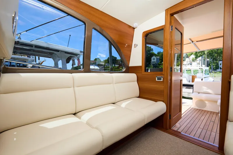 Slide: The Image of Luxurious interior of 2027 Palm Beach 42 yacht with elegant seating and wooden finishes. - 22