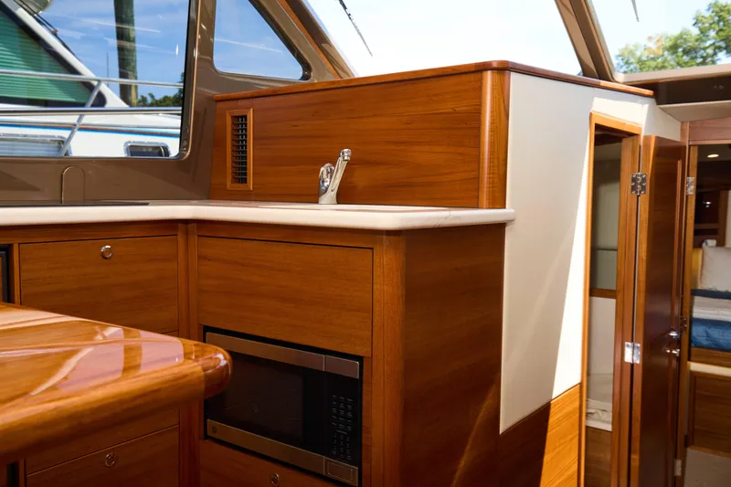 Slide: The Image of Luxurious interior of 2027 Palm Beach 42 yacht with wood finish and modern amenities. - 25