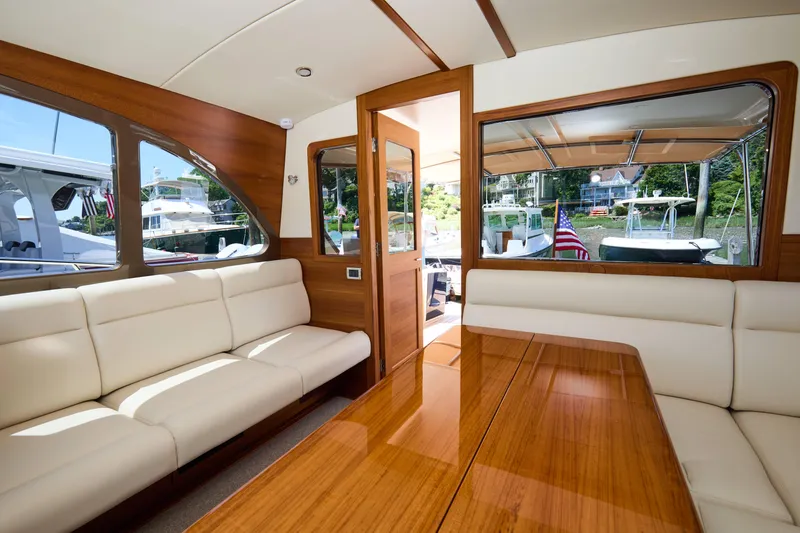Slide: The Image of Luxurious interior of 2027 Palm Beach 42 yacht with elegant wood and leather seating. - 17