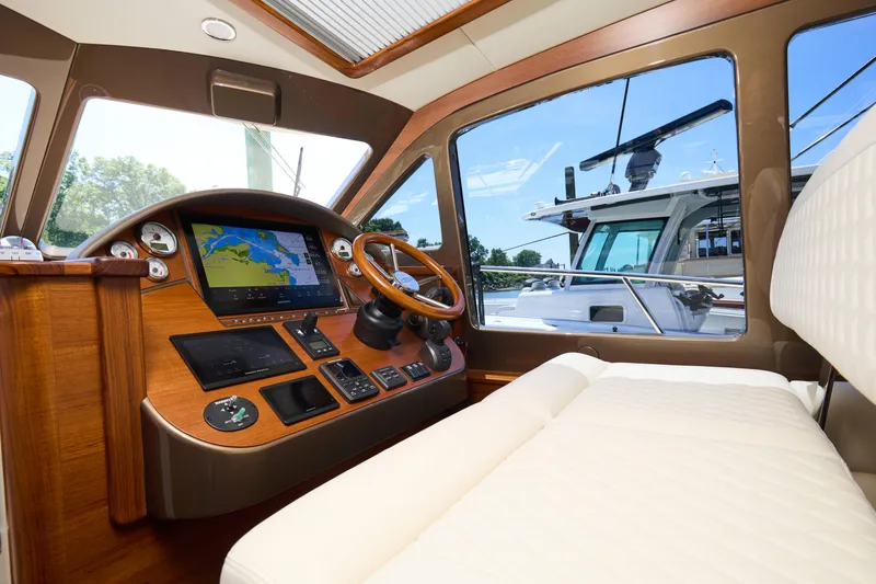 Slide: The Image of Interior of 2027 Palm Beach 42 yacht, featuring a modern helm with navigation display. - 31