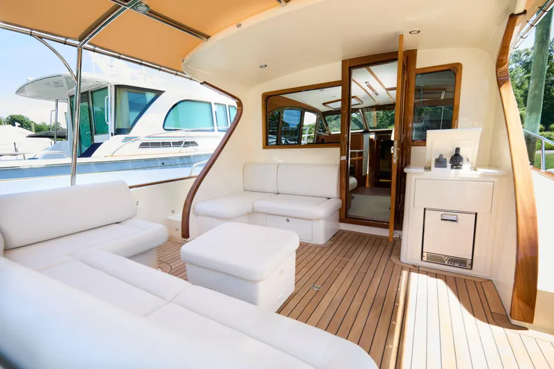 Slide: The Image of Luxurious 2027 Palm Beach 42 yacht interior with elegant seating and wooden accents. - 10