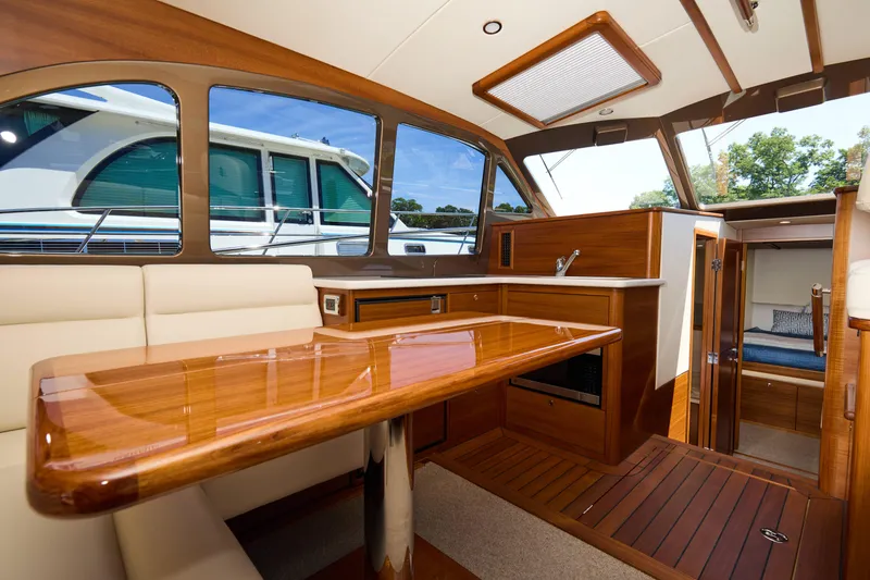 Slide: The Image of Luxurious interior of 2027 Palm Beach 42 yacht with elegant wood finishes and modern amenities. - 18