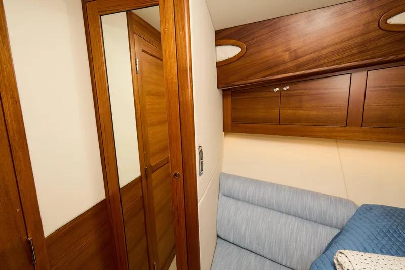 Slide: The Image of Luxurious cabin interior of 2027 Palm Beach 42 yacht with wooden finishes and cozy seating. - 39