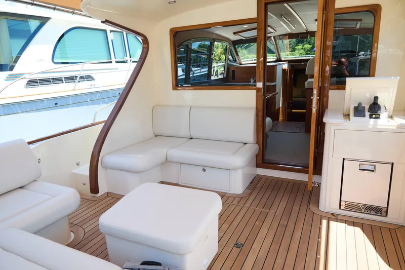 Slide: The Image of Luxurious interior of 2027 Palm Beach 42 yacht with elegant seating and wooden accents. - 12