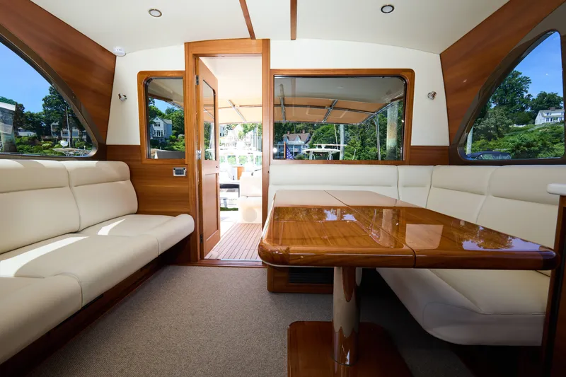 Slide: The Image of Luxurious interior of 2027 Palm Beach 42 yacht with elegant wood and leather seating. - 21