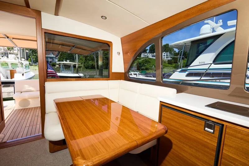 Slide: The Image of Luxurious interior of 2027 Palm Beach 42 yacht with elegant wood and white seating. - 23