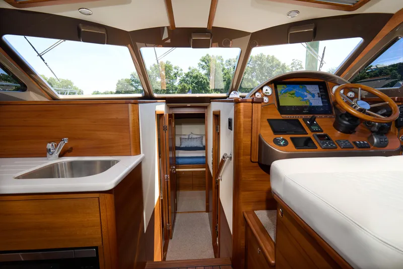 Slide: The Image of Luxurious interior of 2027 Palm Beach 42 yacht with helm, sink, and cabin view. - 28