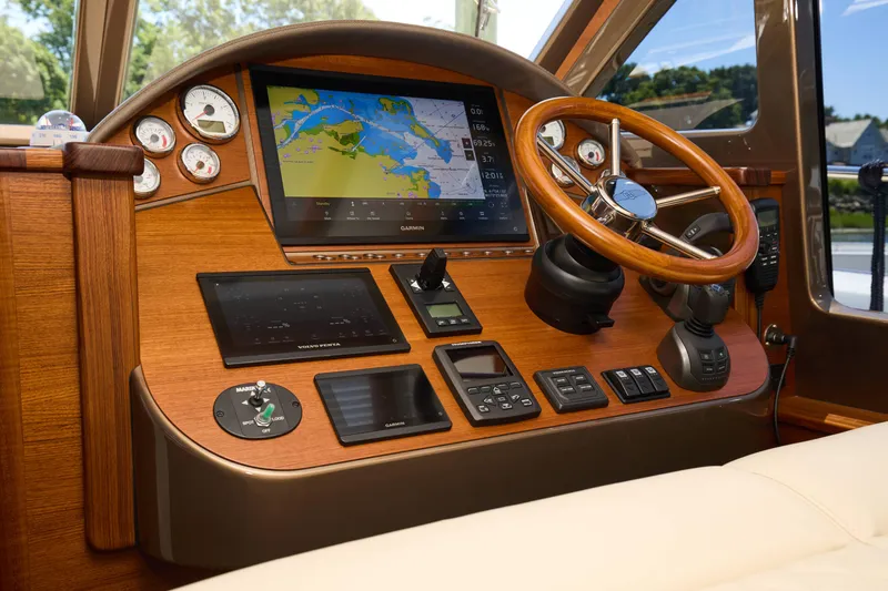 Slide: The Image of Helm of 2027 Palm Beach 42 yacht with advanced navigation and control systems. - 32