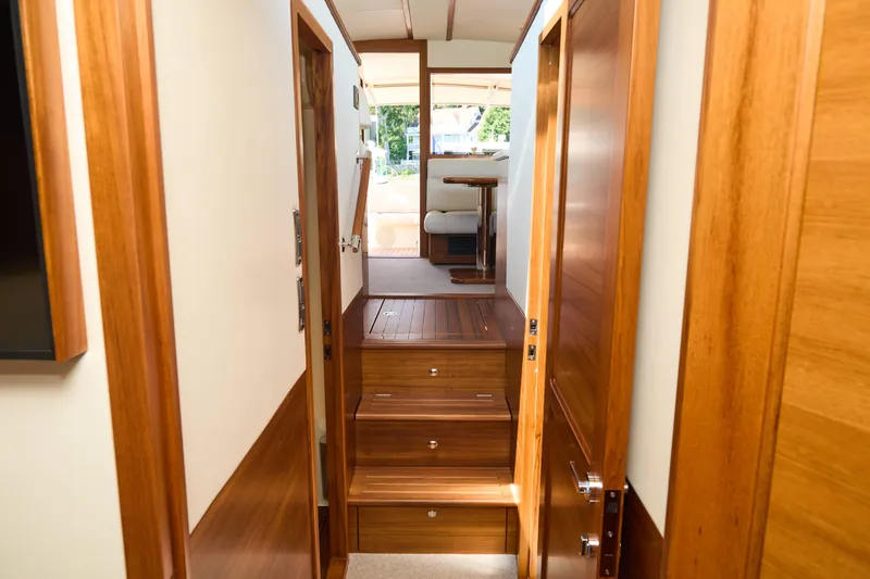 Slide: The Image of Luxurious interior of 2027 Palm Beach 42 yacht with wooden finishes and elegant design. - 34