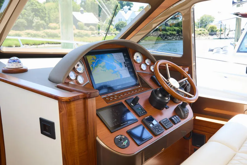 Slide: The Image of Luxurious helm of 2027 Palm Beach 42 yacht with advanced navigation system and wooden steering wheel. - 30