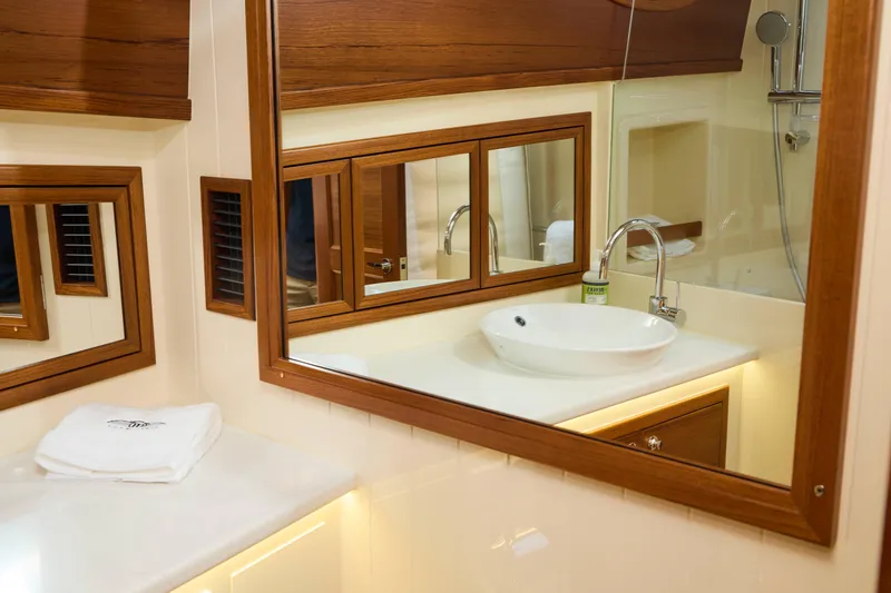 Slide: The Image of Luxurious bathroom interior of 2027 Palm Beach 42 yacht with elegant wood accents. - 43