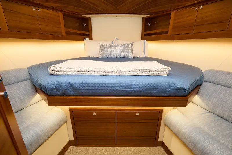 Slide: The Image of Luxurious cabin interior of 2027 Palm Beach 42 yacht with cozy bedding and elegant wood finish. - 35