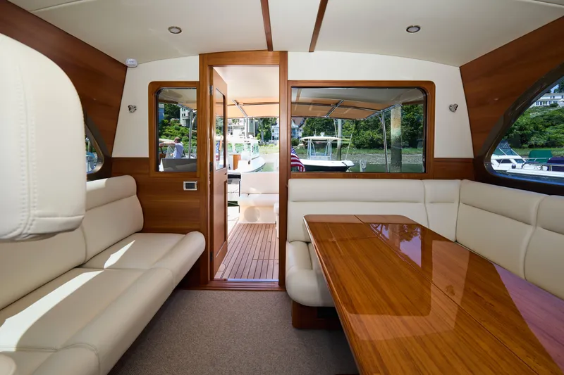 Slide: The Image of Luxurious interior of 2027 Palm Beach 42 yacht with elegant wood and leather seating. - 15