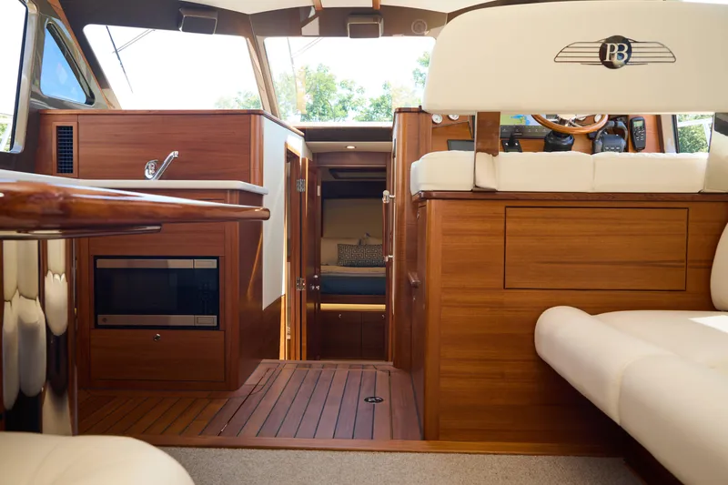 Slide: The Image of Luxurious interior of 2027 Palm Beach 42 yacht with elegant wood finishes and modern amenities. - 26