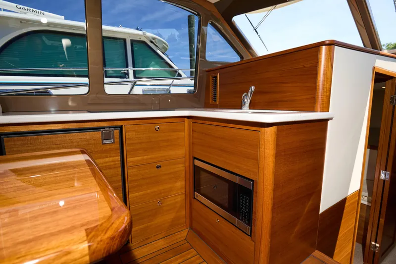 Slide: The Image of Luxurious interior of 2027 Palm Beach 42 yacht with wooden cabinetry and modern amenities. - 27