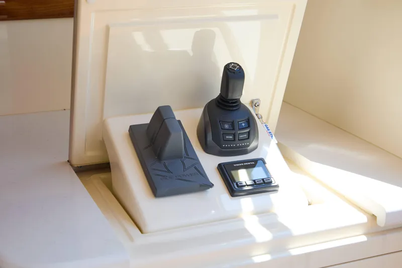 Slide: The Image of Control panel of 2027 Palm Beach 42 yacht featuring joystick and digital display. - 9