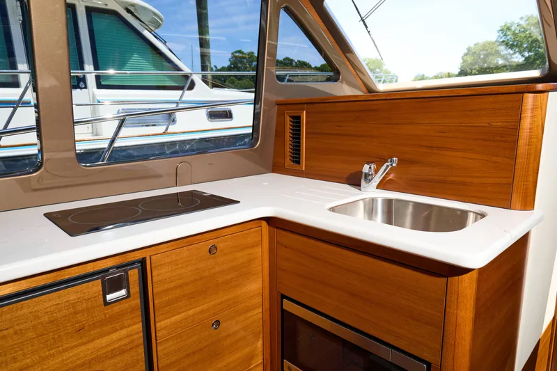 Slide: The Image of Modern kitchen interior of 2027 Palm Beach 42 yacht with sleek wood finish. - 29