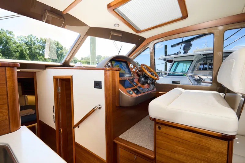 Slide: The Image of Luxurious interior of 2027 Palm Beach 42 yacht with elegant wood finishes and modern helm. - 33