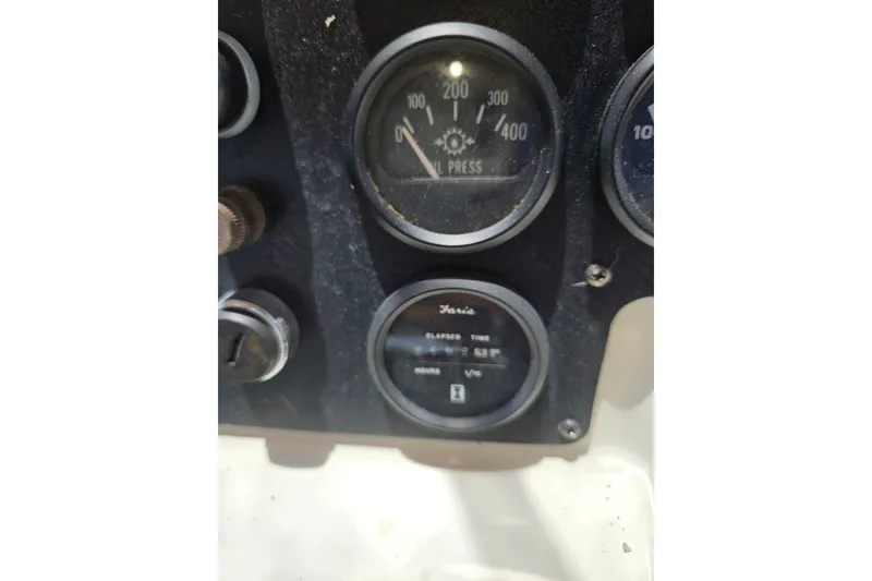 Slide: The Image of Instrument panel of a 1993 Silverton 46 Motor Yacht showing gauges and dials. - 14