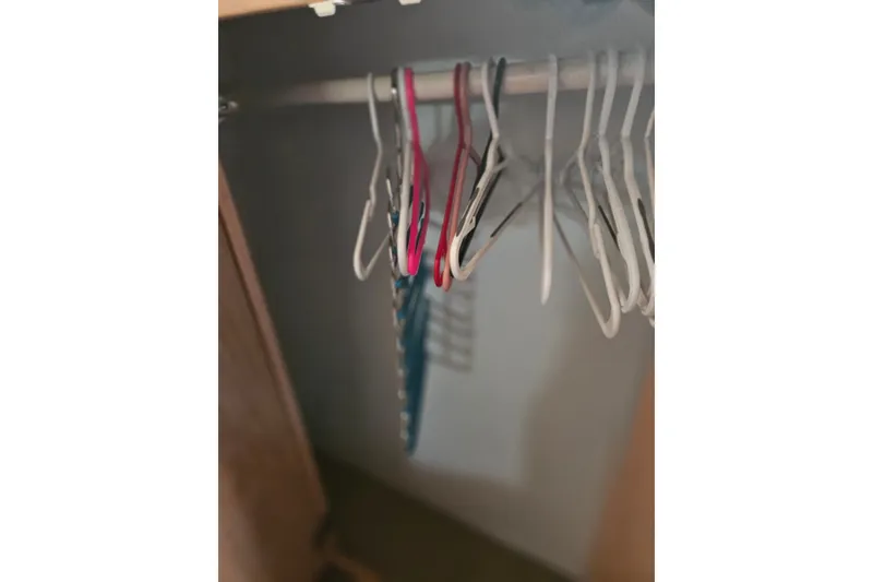 Slide: The Image of Empty closet with hangers on a Silverton 46 Motor Yacht, 1993 model. - 36