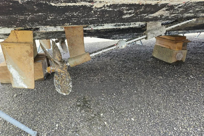 Slide: The Image of Underneath view of a 1993 Silverton 46 Motor Yacht showing propeller and supports. - 61