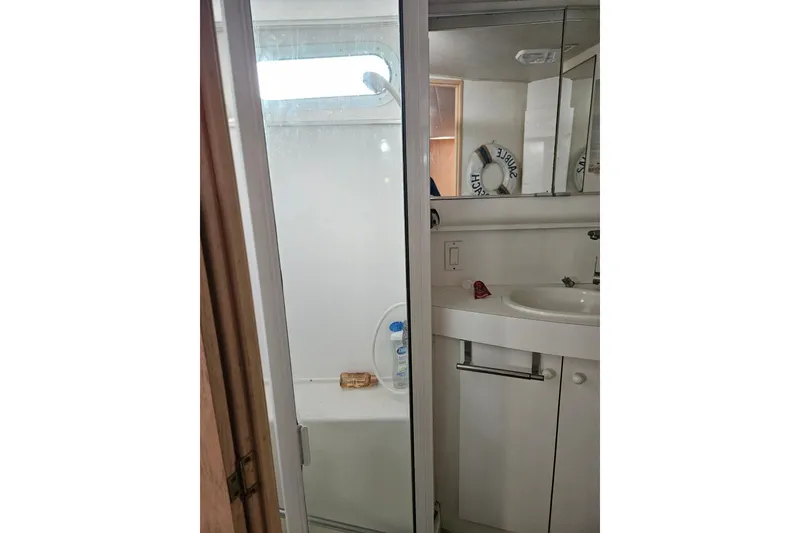 Slide: The Image of Bathroom interior of 1993 Silverton 46 Motor Yacht with shower and sink. - 41