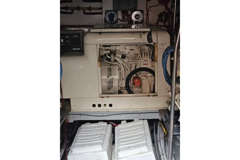 Slide: The Image of Engine room of a 1993 Silverton 46 Motor Yacht with Kohler generator. - 48