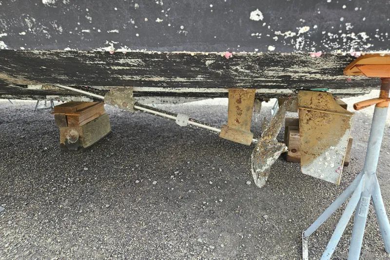 Slide: The Image of 1993 Silverton 46 Motor Yacht underside with visible propeller and supports. - 62