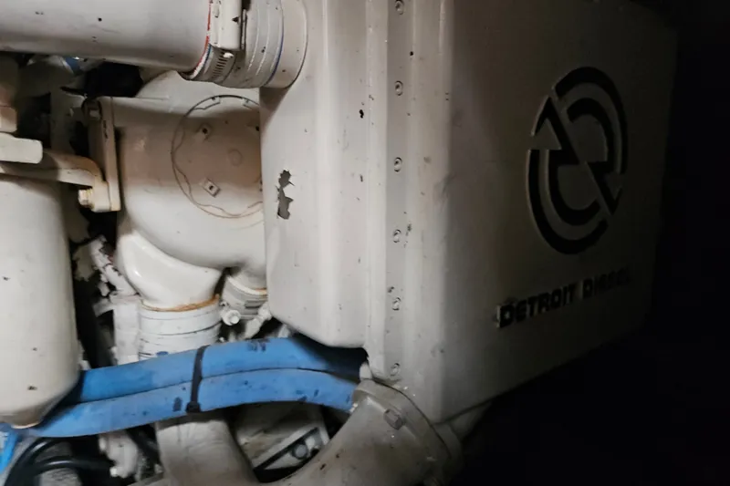 Slide: The Image of Engine compartment of a 1993 Silverton 46 Motor Yacht with Detroit Diesel branding. - 52