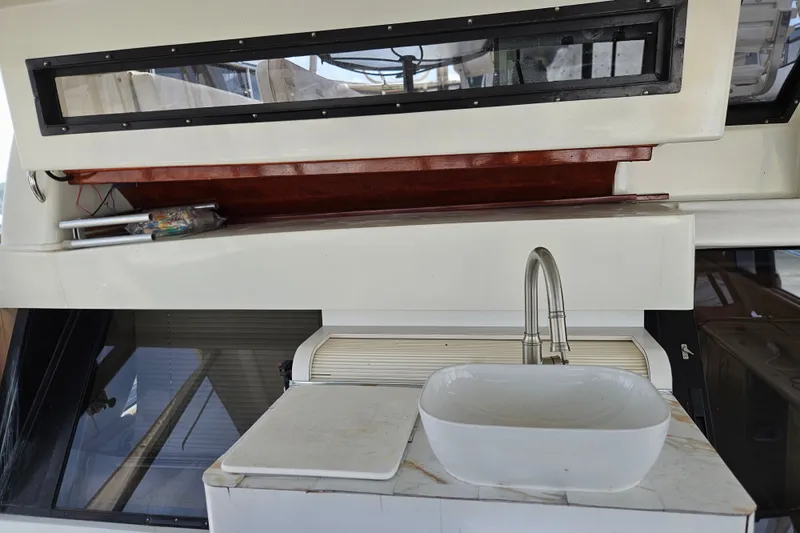 Slide: The Image of Interior view of 1993 Silverton 46 Motor Yacht with sink and storage area. - 16