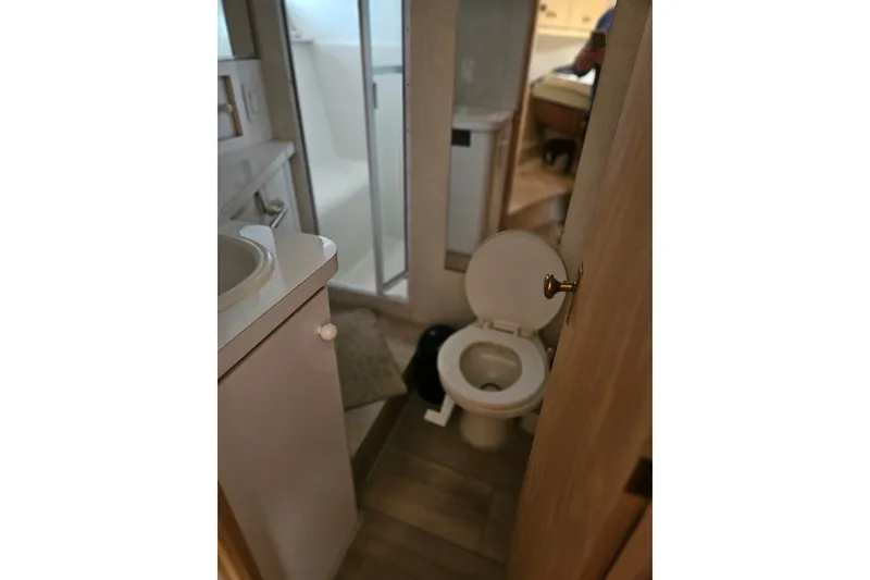 Slide: The Image of Bathroom interior of 1993 Silverton 46 Motor Yacht with shower and toilet. - 22