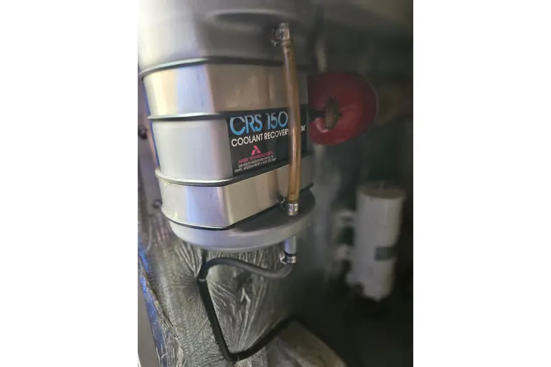 Slide: The Image of Coolant recovery system in 1993 Silverton 46 Motor Yacht engine room. - 54