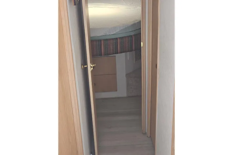 Slide: The Image of Interior view of 1993 Silverton 46 Motor Yacht cabin hallway. - 20